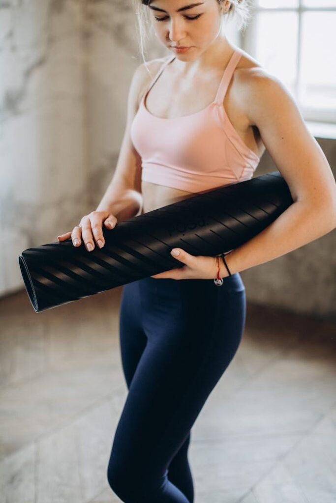 woman-holding-her-yoga-mat-3823208 Woman Holding her Yoga Mat
